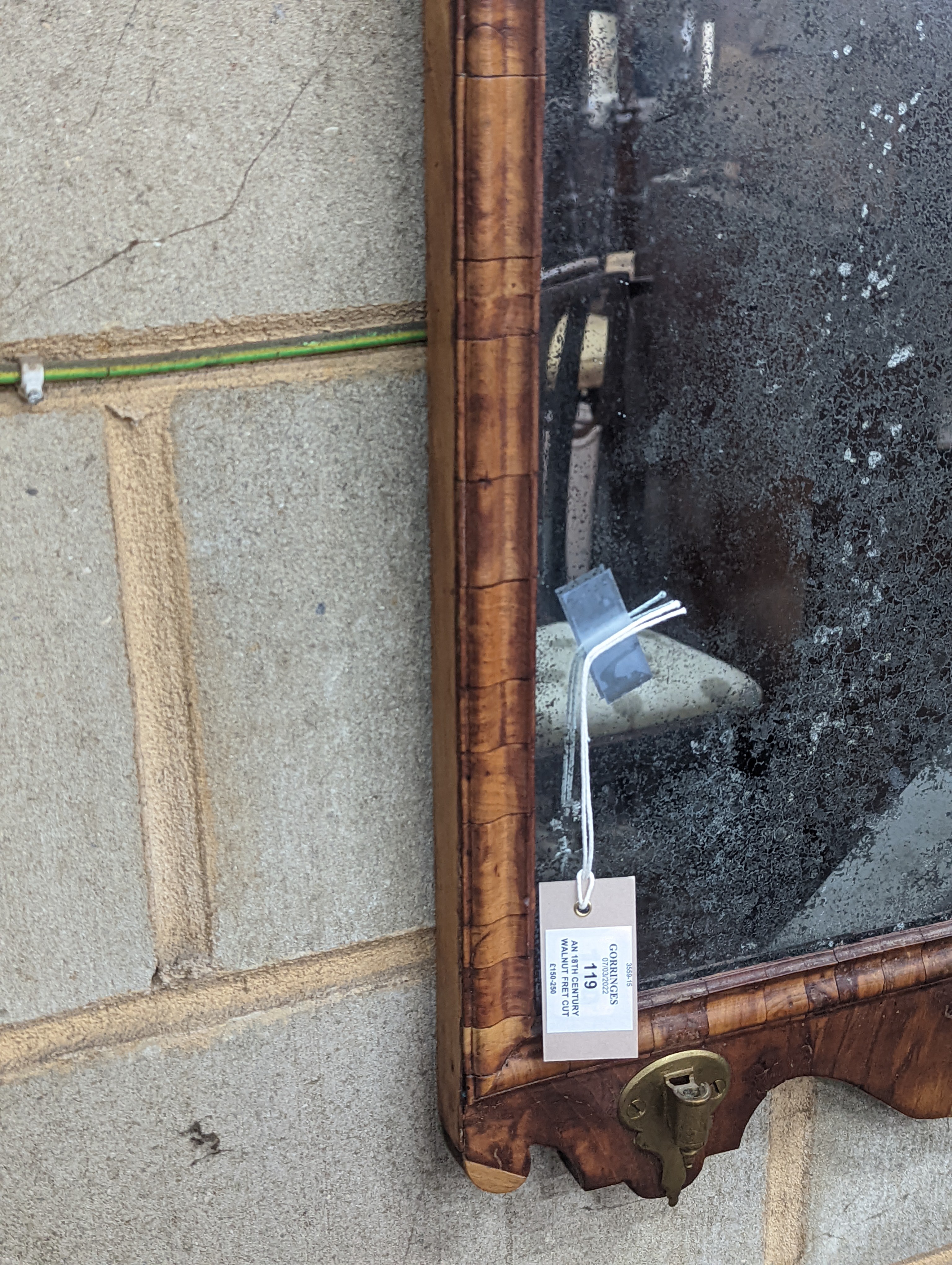 An 18th century walnut fret cut wall mirror, width 48cm, height 96cm